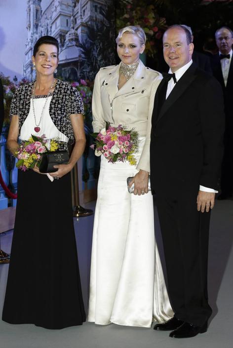Princess Caroline of Hanover, Princess Charlene and Prince Albert II of Monaco arrive for the annual Rose Ball at the Monte-Carlo Sporting Club in Monte Carlo